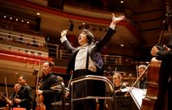 Photograph of Kazuki Yamada accepting applause after the Season Finale.