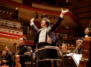 Photograph of Kazuki Yamada accepting applause after the Season Finale.