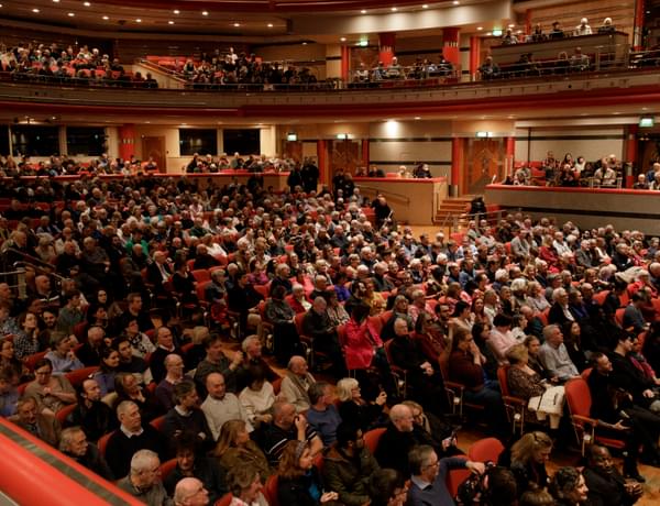 Photograph of people sitting in the stalls at Symphony Hall