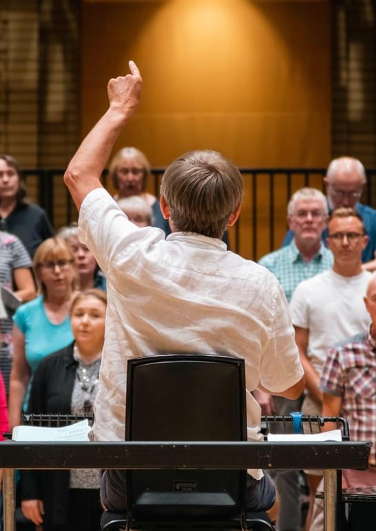 Photograph of Simon Halsey conducting the Chorus in a rehearsal at CBSO Centre