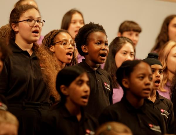 Photograph of the Children's Chorus singing.