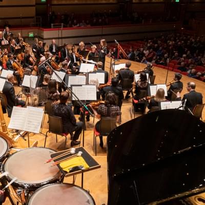 Photograph of the Orchestra on-stage.