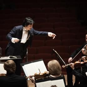 Photograph of Kazuki Yamada conducing the orchestra