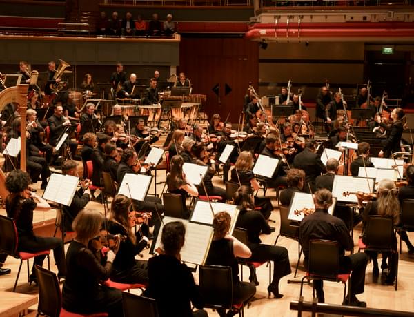 Photograph of the orchestra performing on-stage at Symphony Hall