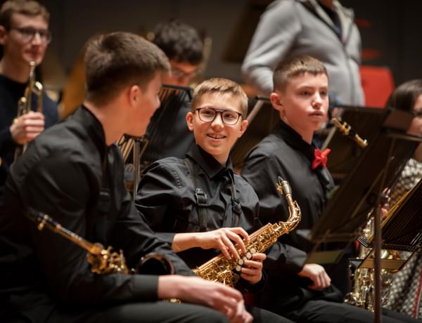 Photograph of boys laughing together during a Project Remix performance