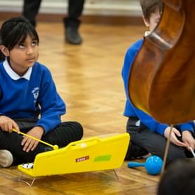 Photograph of a school child playing the glockenspiel