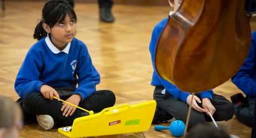Photograph of a school child playing the glockenspiel