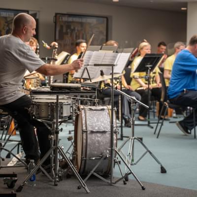 Photograph of a CBSO musician playing a drum kit during a performance at Shireland CBSO Academy