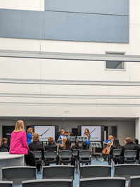 Photograph of a BBC journalist watching filming at the Shireland CBSO Academy