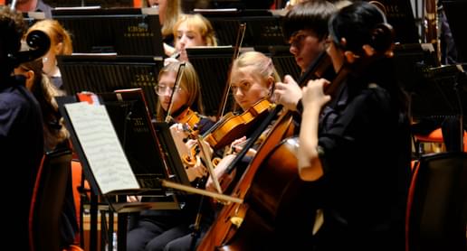 Photograph of a young woman playing the viola in the CBSO Youth Orchestra
