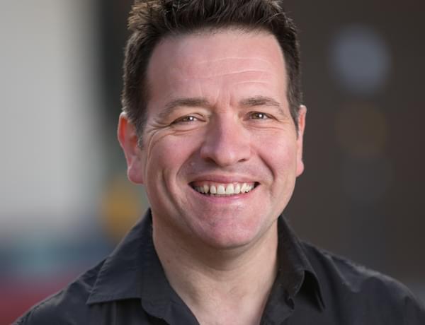 Headshot of double bassist Tony Alcock