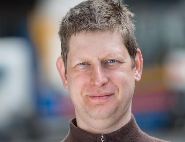 Headshot of violist Adam Romer