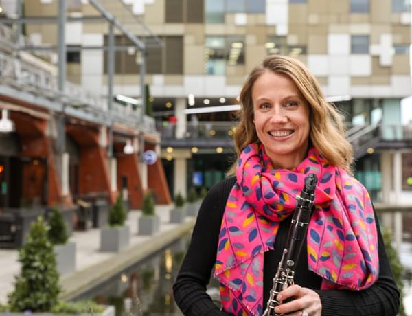Photograph of Joanna Patton holding her clarinet in Birmingham's Gas Street Basin